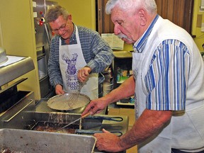 The Elks were busy preparing plenty of oysters Friday evening for the community club's annual dinner. About 150 people came out to the Vulcan Legion Hall. Here, Elk and former Town Coun. Harold Lewis, right, and friend of the Elks and also a former Town Coun. Roy Elmer prepare batches of breaded and fried oysters in the Legion kitchen.

Simon Ducatel/Vulcan Advocate