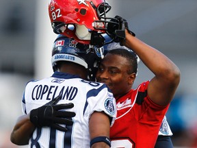 Best friends Jeremaine Copeland of the Toronto Argonauts and Nik Lewis of the Calgary Stampeders share a moment before a CFL game at McMahon Stadium in Calgary, Thursday, July 1, 2010. (AL CHAREST/QMI Agency)