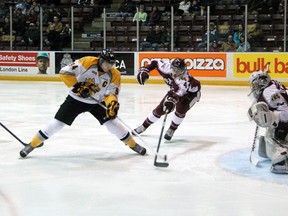Alex Galchenyuk, left, of the Sarnia Sting fires a backhand past Peterborough Petes goalie Andrew D'Agostini for the Sting's first goal Saturday, Nov. 24, 2012 at the RBC Centre in Sarnia, Ont. PAUL OWEN/THE OBSERVER/QMI AGENC