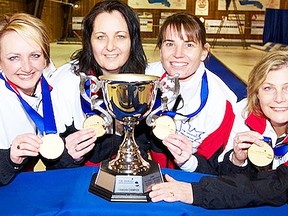 Members of the QCC women's rink skipped by Caroline Deans, far left, celebrate their 2012 Dominion Insurance Canadian club curling championship title Saturday in Scarborough. (Photo courtesy of Dominion.)