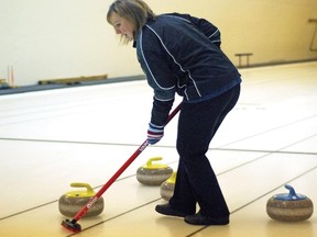 The Village of Milo held its first stick curling bonspiel over the weekend at the village’s curling rink. Twelve teams took part and a few others had to be turned away to make sure games would be done in time to take in the Grey Cup game on Sunday. Here, Leanne Bertschy, from Milo, sweeps for her partner Katie Walker, also from Milo. The pair was playing against Lorne and Laurie Umscheid, also from Milo. Organizers were grateful to have help from the Vulcan Curling Club, which lent a hand getting the stick curling bonspiel ready. 
Simon Ducatel/Vulcan Advocate