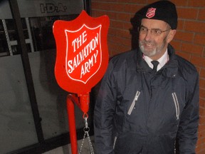 Jim Lewis, Kettle Campaign Co-ordinator for the Salvation Army in Simcoe, set up in front of Roulston's drug store in downtown Simcoe on Friday morning. The annual Christmas fundraiser is underway. (DANIEL R. PEARCE Simcoe Reformer)
