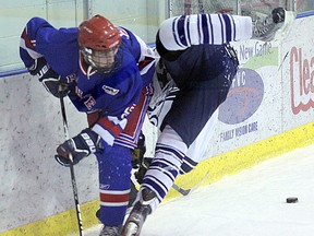 Fort Saskatchewan Midget Ranger Justin Ferris throws a hip check while scrumming for a loose puck behind the Lethbridge Pronghorns net. Ferris would pot one of two goals scored by the Rangers during the Saturday afternoon contest, but the team would fall by a 5-2 score to the visiting squad. Rick Volman/Record Staff