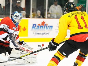 Belleville Bulls forward Michael Cramarossa tests Ottawa 67's goalie Clint Windsor during OHL action Sunday afternoon at Yardmen Arena. (Michael J. Brethour for The Intelligencer.)