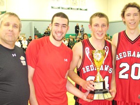 Holy Trinity coach and tournament organizer Dave McCabe presented the Panthers-Falcons Classic Cup to, from left, Smiths Falls RedHawks captains Turner Onion, Sam Dickson and Nick McGonegal on Saturday. The Redhawks beat the Falcons 51-41 in the senior final.