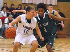 DARRYL G. SMART, The Expositor

Assumption's Austin Tlustos looks to get past St. John's defender Adam Peters during the senior high school boys basketball Ed O'Leary Memorial Tip-Off Tournament final Saturday.