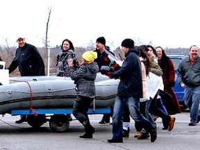 CAPTION-Downtown2

KARA WILSON, for The Expositor

A large raft makes its way along downtown Colborne Street to Harmony Square for Saturday's "Lip Dub."