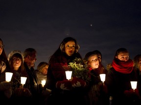 Beaumont residents participate in a candlelight vigil in Beaumont, Alta., on November 25, 2012. The vigil commemorated the lives of Kole Novak, 18, Bradley Arsenault, 18, and Thaddeus Lake, 22, who died after a collision on Highway 625 on Nov. 26, 2011 with an alleged drunk driver. (Ian Kucerak/Edmonton Sun)