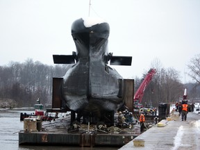 The Cold War-era sub was safely moved into position for offload on Sunday. Decision will be made by noon Monday as to whether to proceed today.
