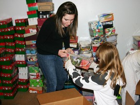 Youth volunteers help during pickups for Operation Christmas Child as the local organization surpassed their 2000 shoebox-goal over the weekend.  (Eileen Warthe/Submitted photo)