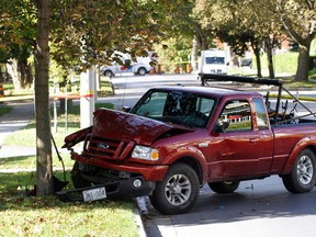 Members of the Ontario Special Investigation Unit (SIU) and Belleville, Ont. Police Service investigate a single motor vehicle collision where a pickup truck crashed into a tree on Bridge Street East at the corner of Williams Street an George Street Saturday, Oct. 13, 2012  - JEROME LESSARD/THE INTELLIGENCER/QMI AGENCY