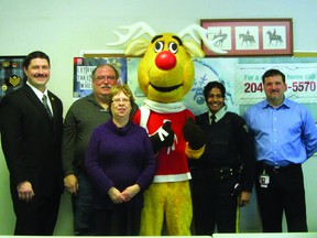 City councillor Ryan Espey, Operation Red Nose coordinator Leo Lapointe, Judy Murphy, President and CEO of Safety Services Manitoba, Rudy the mascot, Const. Shannon Neff, and Joel Gervais, social responsibility coordinator for Manitoba Liquor Control Commission pictured during the Operation Red Nose launch in Portage la Prairie, Monday. (ROBIN DUDGEON/THE DAILY GRAPHIC/QMI AGENCY)