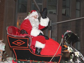 STEPHEN UHLER    Hello again! Santa makes an appearance at the Santa Claus Parade of Lights, held in Pembroke the evening of Nov. 24, 2012. Thousands lined the streets to greet him.