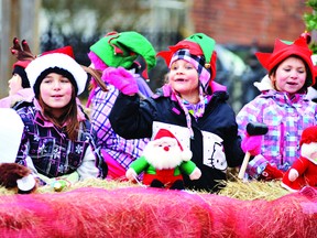 The excitement of the season shines through on the faces of these girls in Santa's workshop on the Sunshine Cleaners float in Brockville's Santa Claus Parade. From left are Mika Brown, Mya Carr and Madison Brown-Lane.
(NICK GARDINER/The Recorder and Times)