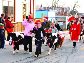 Grier Gables got into the cowboy country theme of Sunday's Lansdowne Santa Claus Parade by bringing many happy faces and a small sea of horses to the village streets.
NICK GARDINER Gananoque Reporter