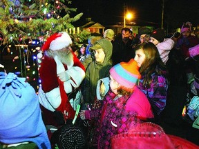 Santa visits with children during the 2011 tree lighitng celebration in Verona.     Rob Mooy, Kingston This Week