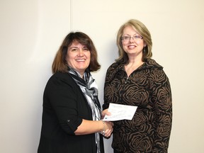 Lise Wadlow, chair of the Whitecourt Christmas Hamper, accepts a cheque from Mary Newcombe, general manager of the Road House Pub & Grill, where she has been accepting donations for the hamper.
Johnna Ruocco | Whitecourt Star