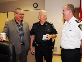 Woodstock Police Chief Rod Freeman, left, and St. Thomas Police Chief Bill Lynch, right,, share a laugh and some stories with St. Thomas Police Staff Sgt. Steve Withenshaw during a gathering on his retirement at the end of October. Chief Freeman joined the force in 1982 and Chief Lynch began his career in 1978, joining Withenshaw, who joined the force in 1976.  The three were beat officers together for a period of time
