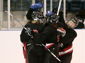 Expositor file photo

Defending champion Paris District High School Panthers, shown celebrating a goal in last season's championship game against the Assumption College Lions, will be challenged this season by the Lions and the North Park Collegiate Trojans.