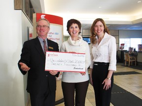 Cornwall Scotiabank branch manager Earl McBean (left) and Scotiabank district vice-present Karine Abgrall (right) present United Way campaign chair Peggy Haramis with $20,000 towards the 2012 fundraiser.