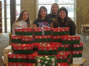 Students at Delhi District Secondary School assembled shoebox gifts for Samaritan’s Purse’s Operation Christmas Child. Standing with the 42 collected shoeboxes on Thursday are, from left to right, Angela Kovacs, Rebecca Ladd, Luann Beselaere-Hammond and Erin Pecceu. (Contributed photo)