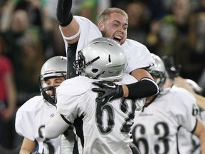 Port Colborne’s Lakeshore Catholic Gators celebrate their come-from-behind victory over the Burlington’s M.M. Robinson High School Rams in the Golden Horseshoe Bowl at the Rogers Centre, Tuesday, Nov, 27, 2012. (Craig Robertson/Toronto Sun)