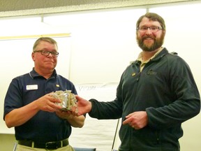 Darcy Kitzinger, Alberta Barley Commission Research and Policy coordinator (right), presents Ron Heck with a token of appreciation for his six years of service on the Alberta Barley Commission. Heck has served the maximum term allowed as director and was elected as a delegate.
CHRIS EAKIN/FAIRVIEW POST/QMI AGENCY