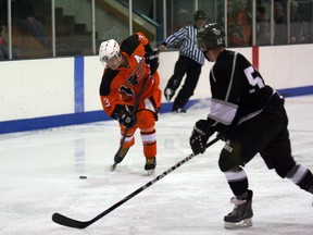 aylor Bjorklund of the Fairview Flyers and Mac Putio of the Grande Prairie JDA Knights during  NWJHL action at the Fairplex arena in Fairview on Saturday, Nov. 24, 2012. It was the first time the two teams played against each other this season. (Simon Arseneau/Fairview Post)