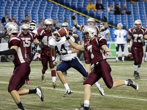 Frontenac Falcons quarterback Tyler Filson scores a touchdown against thde St. Joan of Arc Knights of Barrie during the National Capital Bowl at the Rogers Centre in Toronto on Tuesday 
IAN MACALPINE/QMI Agency