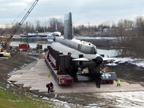 The former HMCS Ojibwa came ashore Tuesday afternoon to much applause and cheers from the large crowds that gathered in Port Burwell. The official 'landing day' took place exactly one week after the cold war era submarine arrived in Port Burwell. The move is expected to be complete, with Ojibwa on its new, permanent concrete foundation by Wednesday afternoon. 

KRISTINE JEAN/TILLSONBURG NEWS/QMI AGENCY