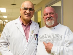 Heart transplant recipient Daniel Shipman poses for a photo with his surgeon Dr. Haissam Haddad following a press conference at the University of Ottawa Heart Institute where it was announced that last week they had performed its 500th heart transplant. Errol McGihon/Ottawa Sun/QMI Agency