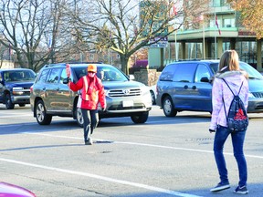 Crossing guard Joan Ladouceur-Christie helps two students cross the street at Stewart Boulevard and Central Avenue in Brockville on Tuesday, one of the city's busiest intersections. Brockville was rated first overall in the Ontario Safe Driving Study.
(ALANAH DUFFY/The Recorder and Times)