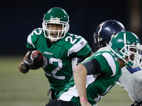 Jaydon Gauthier of W.F Herman of Windsor runs the ball during the Western Bowl against Assumption College School on Tuesday. (MICHAEL PEAKE/Toronto Sun)