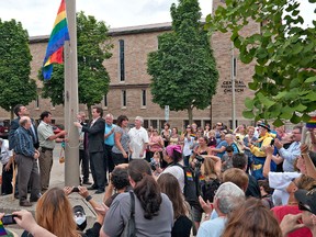 Expositor file photo

Brantford Mayor Chris Friel helps raise the Pride flag at city hall.