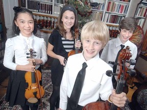 SCOTT WISHART The Beacon Herald
Members of the Kathleen Parlow String Quartet, from left, Jiwon Baxter, 10, Ashley Vito, 12, Hardy Westman, 10, and Liam Westman, 13, are among the performers who will take the stage for the annual Stratford and Area World Aid Old-Fashioned Christmas Concert at St. John's United Church this Sunday, Dec. 2, at 7 p.m. A freewill offering for admission will be donated Doctors Without Borders.