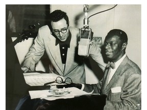 Singer Nat King Cole, right, works alongside composer Pete Rugolo, left, in this undated publicity photograph. 
FILE PHOTO Reuters