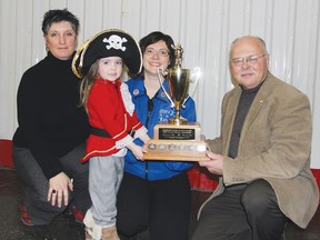 STEPHEN UHLER   The Starz In Motion Dance Studio won the trophy for the Best Float from an Organization/Business in Pembroke’s  2012 Santa Claus Parade of Lights. In the photo are, starting from left, Suzanne Lance, representing the city’s recreation department, Cailyn Lafave and Natalie Lafave, representing Starz In Motion, who accept the trophy from Mayor Ed Jacyno.
