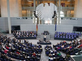German Chancellor Angela Merkel (C) addresses a session of the Bundestag, German lower house of parliament, at the Reichstag in Berlin September 12, 2012. (Reuters/FABRIZIO BENSCH)