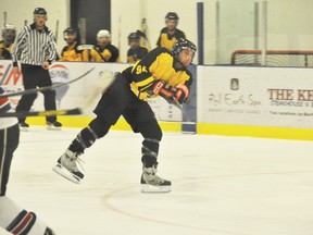 Elkoholic Stefan Kuhn fires a puck off toward the net during Sunday, Nov. 25's game against Tony Roma's at the Fenlands Rec Centre. The Elkoholics won 6 to 2. CORRIE DIMANNO/BANFF CRAG & CANYON/QMI AGENCY