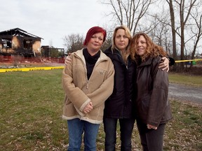 Shelley Hull, Julie Stinson, and Janet Lloyd stand in front of Stinson's house in Newburgh, which was destroyed by fire on Nov. 23. Hull and Lloyd are just two of the community members who have pulled together to support the Stinson family during this difficult time.