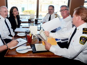 Lisa Warriner, executive director of Victim Services, is seen here with superintendent of Hastings County EMS Gerry Buss, Bruce Greatrix of the Belleville Fire Department, Rick Caddick of the Sitrling-Rawdon Fire Department, Tom Reid of the Stirling-Rawdon Police Service, and John Whelan, chief of the Quinte West Fire Department during a meeting held Nov. 22, 2012 in Trenton, ON. Missing are Insp. Pat Finnegan of the Napanee OPP, Insp. Mike Graham of the Belleville Police Service and Chief Ron Maracle of Tyendinaga Police Service. 
EMILY MOUNTNEY/TRENTONIAN/QMI AGENCY