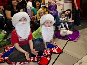 Children enjoy a past edition of the Jingle On Santa Claus parade in downtown Edmonton.