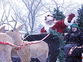 Santa arrived on an appropriately snowy day as the jolly old elf was the centre of attraction during he Chamber of Commerce's Santa Claus Parade. Rick Volman/Record Staff