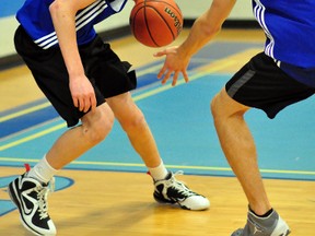 Scott McDowell, left, of the Timmins High & Vocational School Blues drives the ball up the court against teammate Ben Joron during a practice at the TH&VS gym on Monday. The Blues will host the 38th annual Lake Shore Gold Cup Classic this weekend. Tipoff is at 12:30 p.m. Friday, with action in senior and junior divisions at four local gyms.