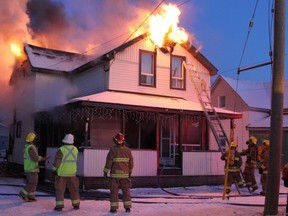 Fire broke out in this older two-storey wood frame apartment house late Wednesday afternoon in Timmins.   Timmins Times LOCAL NEWS photo by Len Gillis.