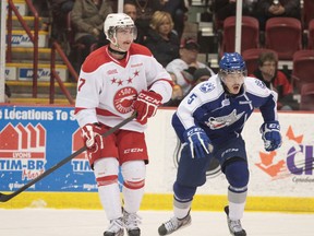 Soo Greyhound Andrew Fritsch (7) and Sudbury Wolves Jeff Corbett (5) skate after puck on Wednesday Nov., 28, 2012. The game was played at the Essar Centre in Sault Ste. Marie, Ont., final score not yet available. RACHELE LABRECQUE - SAULT STAR/ QMI AGENCY