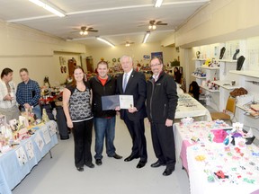 Tyler and Tammy Rickey celebrate the grand opening of Quinte Vendors' Market in downtown Trenton Friday afternoon along with Mayor John Williams and Bob Rowbotham, chairman of the DBIA board.

Emily Mountney/Trentonian/QMI Agency