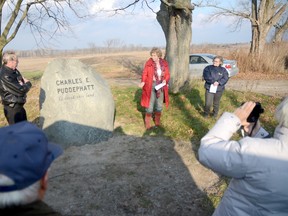 Gayle Fox (top right, red jacket.) addresses a crowd of people during a ceremony to honour her uncle, Charles Puddephatt at Murray Marsh near Codrington, ON., on Friday, Nov. 23, 2012. Puddephatt was a life long resident of the Murray Marsh. The Lower Trent Conservation purchased the 590 acres in the marsh from Puddephatt in 1989. He was given a life lease of the property and cared for the land until his death in 2012.


EMILY MOUNTNEY/TRENTONIAN/QMI AGENCY