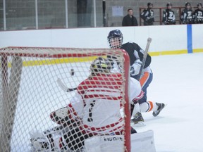 Logan Land, seen here scoring a goal for Holy Trinity,  is set to join the Rochester Institute of Technology Tigers girls hockey team. (File Photo)