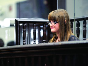 Defendant Crystal Carr (St. Mary student Alison Purcell) listens to testimony while seated in the dock for the accused at the Brockville Court House during high school Law Day on Thursday (DARCY CHEEK/The Recorder and Times).